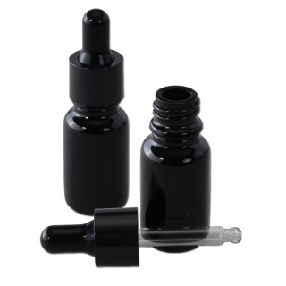 Schwarze Glasflasche mit aufgesetzter Pipette, eine Flasche mit Schraubverschluss geöffnet, transparente Pipette liegt davor, schwarzer Deckel.