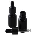 Schwarze Glasflasche mit aufgesetzter Pipette, eine...